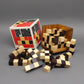 125er Cube Denkspiel aus Holz mit verschachtelten Würfeln und passender Verpackung.