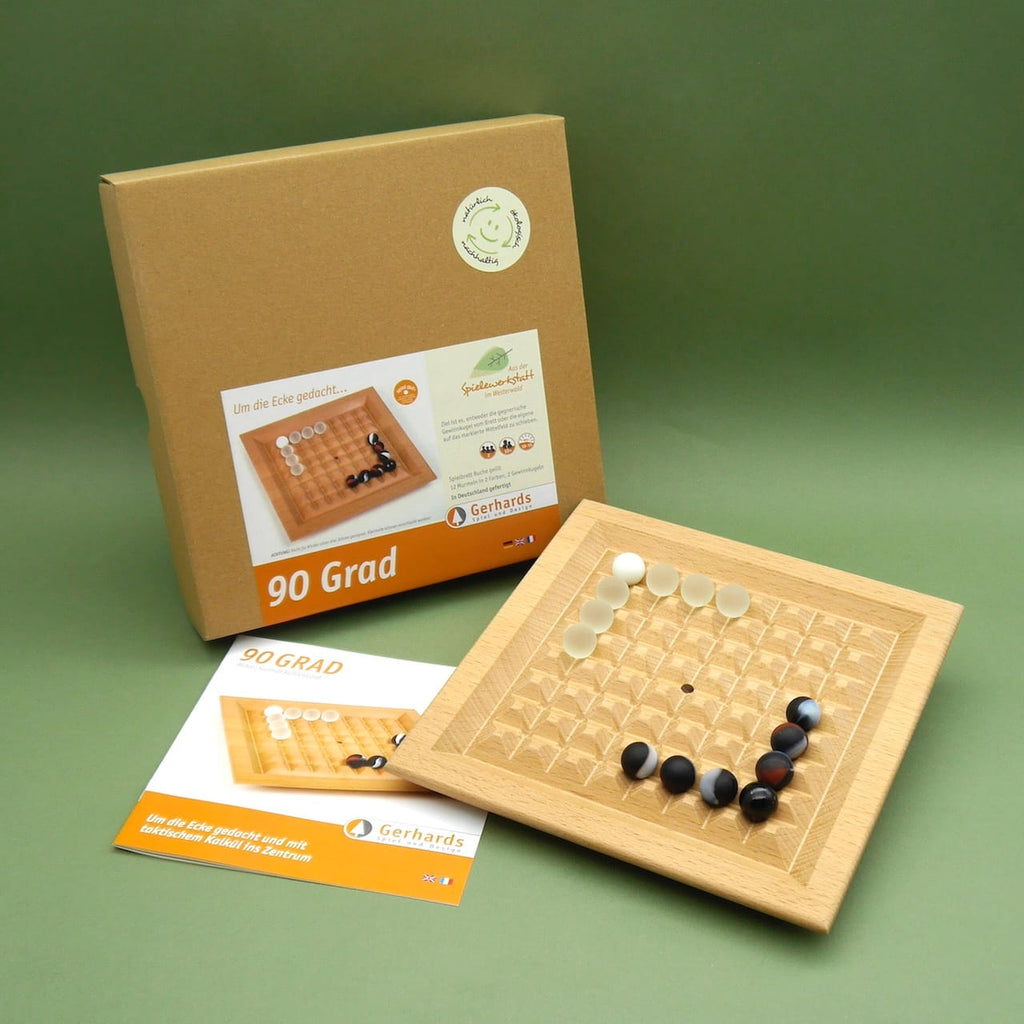 Spiel „90 Grad“ mit Spielbrett aus Buche, Glassteinen, Anleitung und Box im Set auf grünem Untergrund – Holzbrettspiel