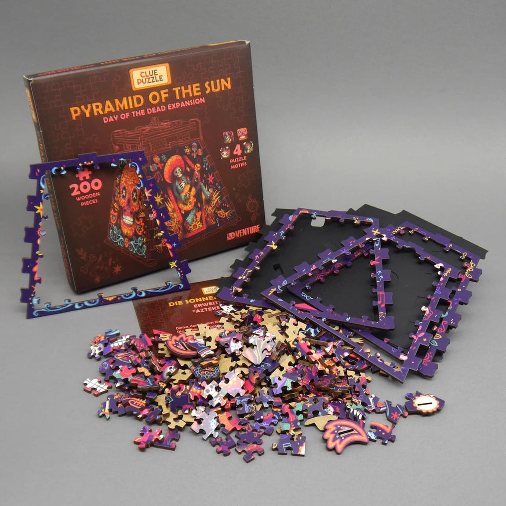 Verpackung und Bauteile eines 3D Mystery Puzzle: farbig bedruckte Rahmen, viele Teile und Anleitung als kniffliges Denkspiel.