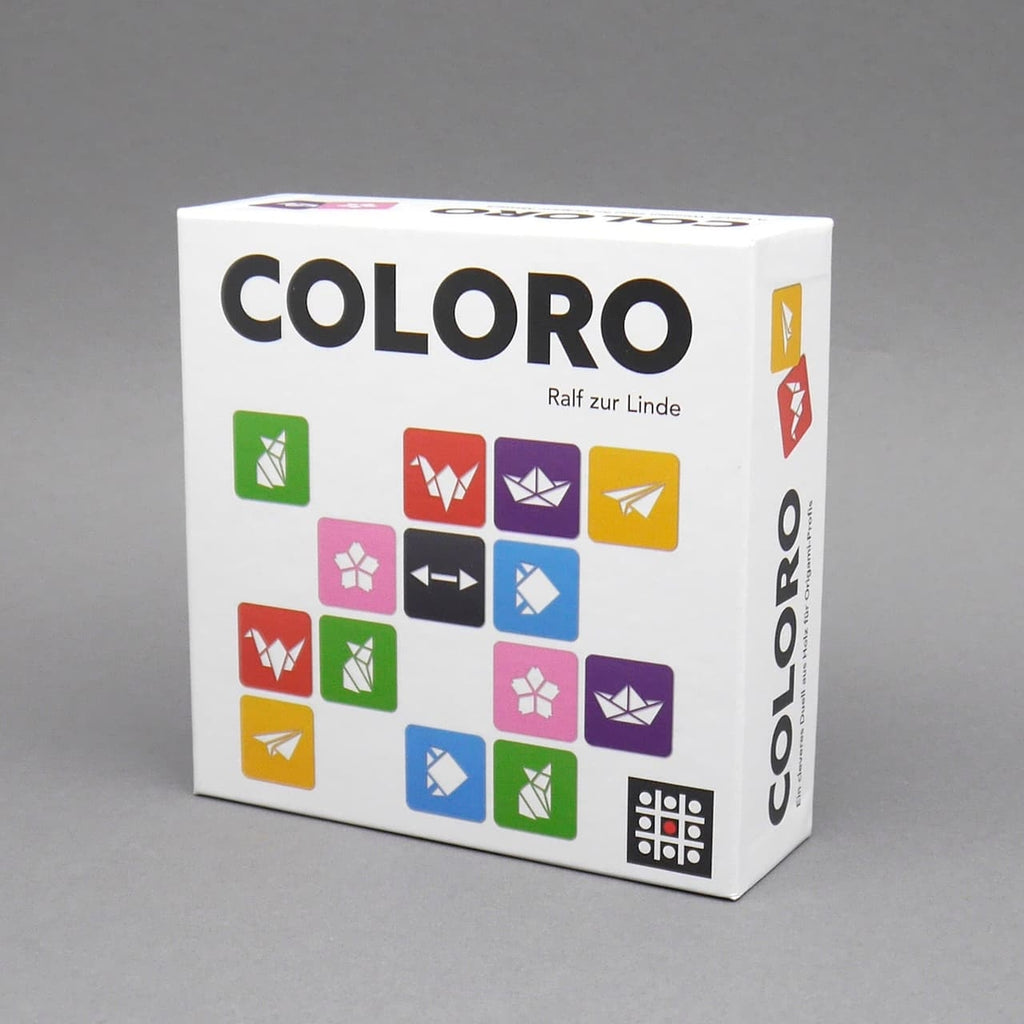 Legespiel Coloro in weißer Schachtel mit bunten Symbol-Kacheln auf der Vorderseite.