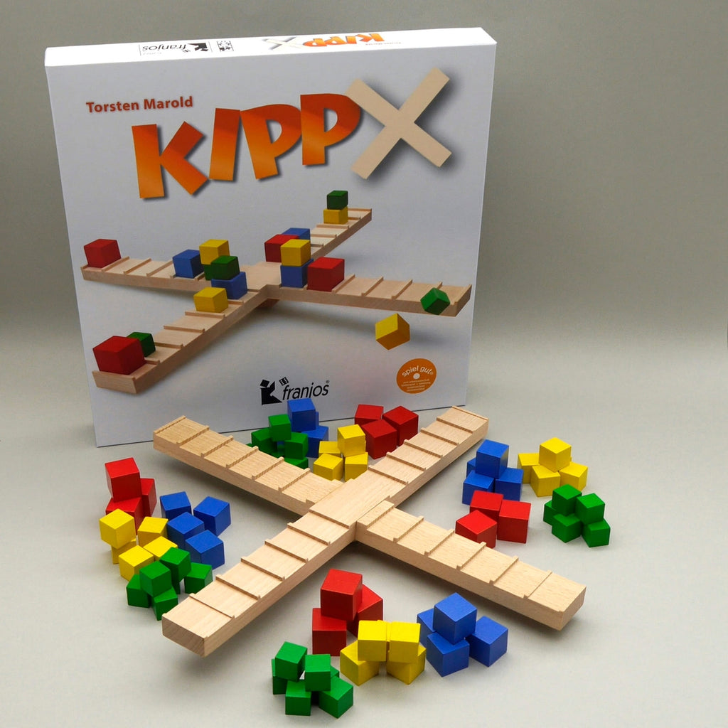 Gesellschaftsspiel KIPP X mit Holzbrett und bunten Spielsteinen für kreatives Balancieren.