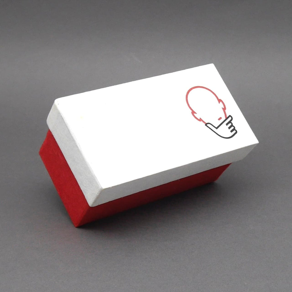 Rechteckige Geschenkbox mit schlichtem Design und Denkspiel-Symbol, passend für Holzpuzzles und Geduldsspiele.