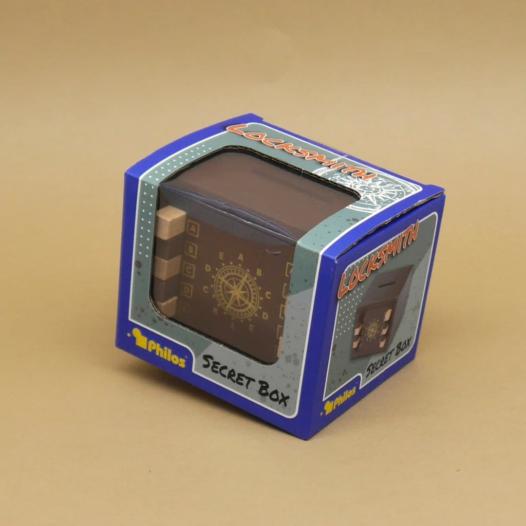 Verpackte Geschenkverpackung der „Locksmith Secret Box“ mit Sichtfenster und farbenfrohem Design.