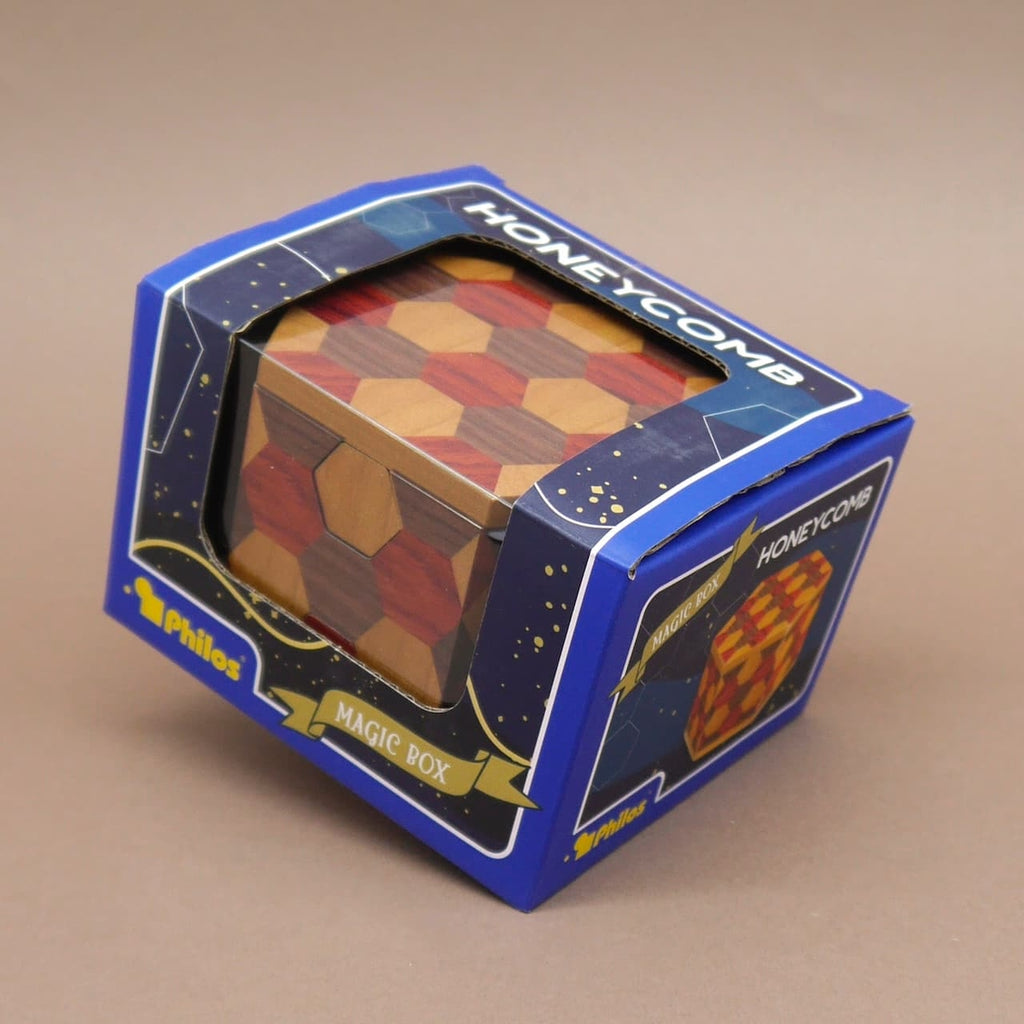 Honeycomb Magic Box in blauer Verpackung als Logikpuzzle präsentiert.
