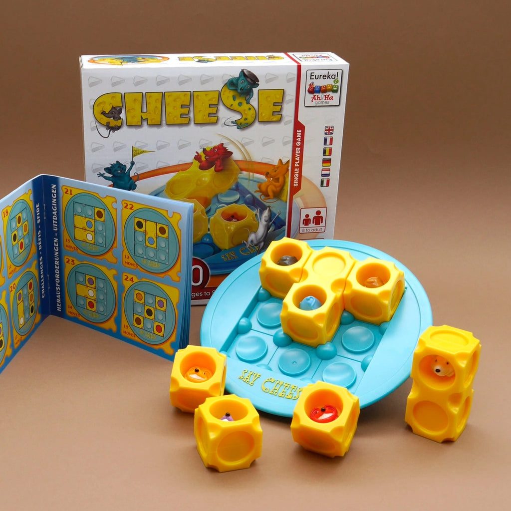 Say Cheese Denkspiel mit gelben Käseblöcken, Spielfeld und Aufgabenheft für logische Schiebe- und Rollrätsel.