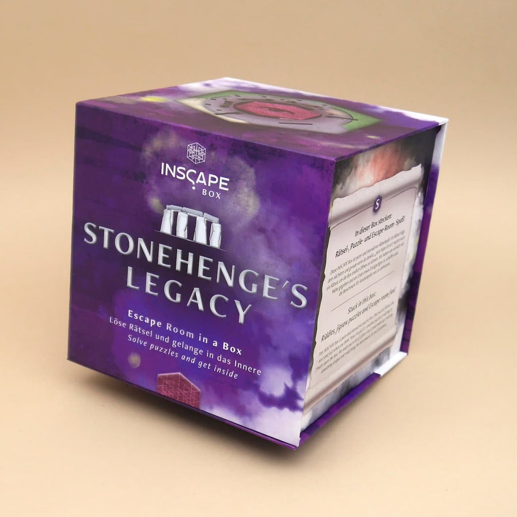 Produktfoto der Stonehenges Legacy Woogengame-Box; Geduldsspiel mit Geheimfach, violett gestalteter Würfel mit drehbaren Mechanismen und Runen.
