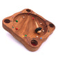 Das Gesellschaftsspiel Tiroler Roulette aus Holz mit Kreisel und 8 Kugeln in verschiedenen Farben
