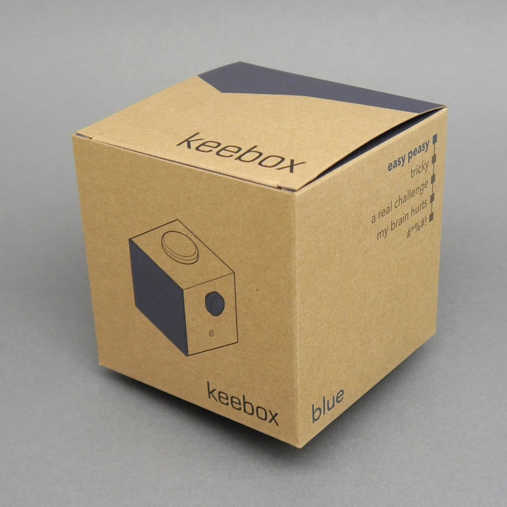 Keebox blue Knobelbox: braune Produktverpackung mit Schwierigkeitsanzeige, minimalistisch fotografiert.